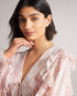 IRVETE-Trousers-Ideal for sunny walks along the river or enjoying a pub lunch, IRVETE is as easy to throw on as it is captivating. Finished with ruffles, this romper is a must-have for your summer wardrobe. Ted Baker womenswear collection Romper Soft ruffle detail Fully lined Our model is 5'9" / 1.75m and wears a Ted size 1- Ted Baker Romania